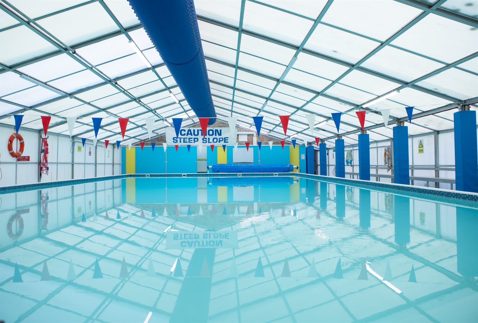 The Boxgrove pool with bunting overhead